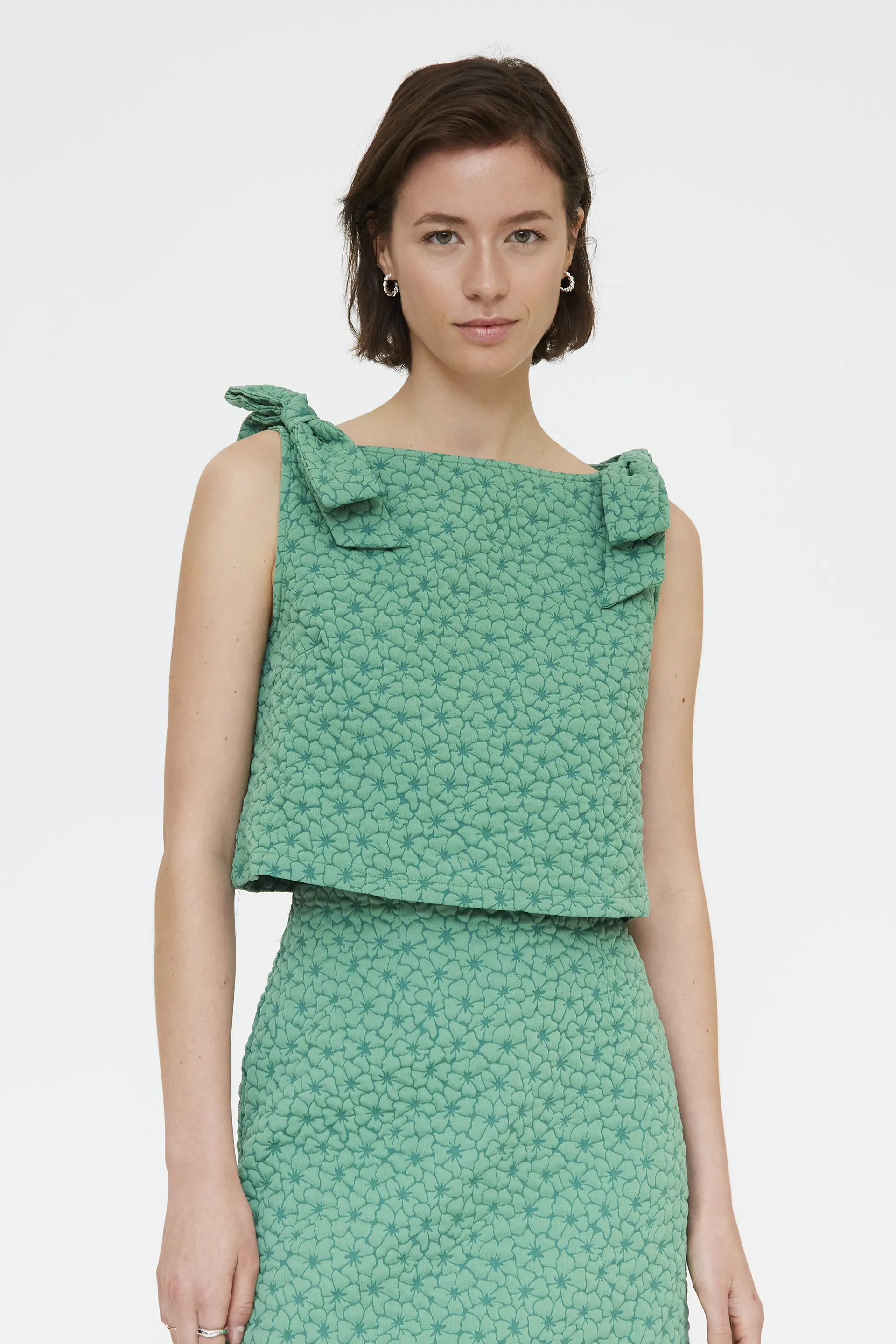 Top con textura floral verde